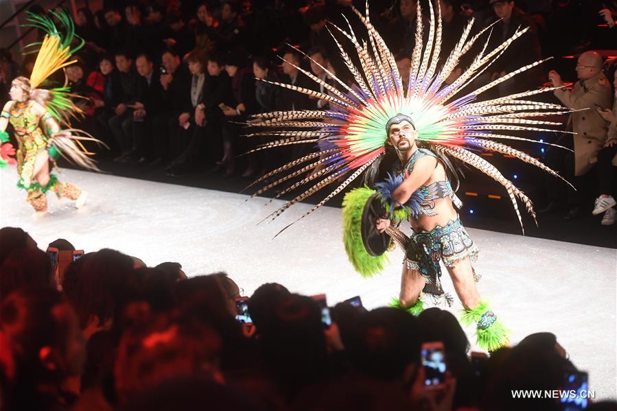 A model shows a creation of Aimer during the China Fashion Week in Beijing, capital of China, Oct. 30, 2016. (Xinhua/Jin Liangkuai) 