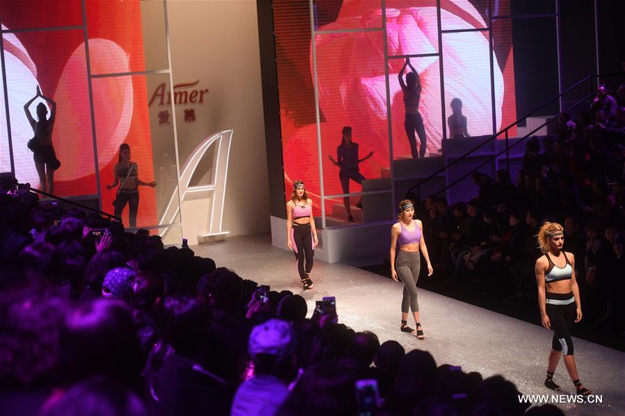 A model shows a creation of Aimer during the China Fashion Week in Beijing, capital of China, Oct. 30, 2016. (Xinhua/Jin Liangkuai) 