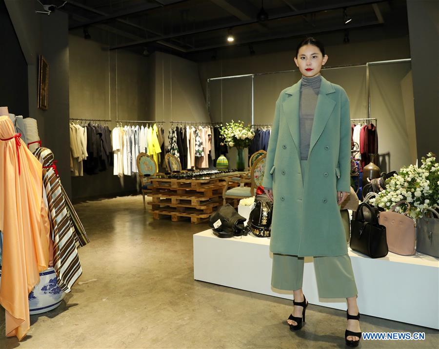 A model presents a creation of designer Zhang Yichao at an inauguration ceremony of an incubator of fashion and innovative talents in Hangzhou, capital of east China's Zhejiang Province, March 17, 2017. The talents incubator is jointly developed by fashion college of Zhejiang Sci-tech University, School of Fashion of Wuhan Textile University and a customization platform. (Xinhua/Chen Jianli) 