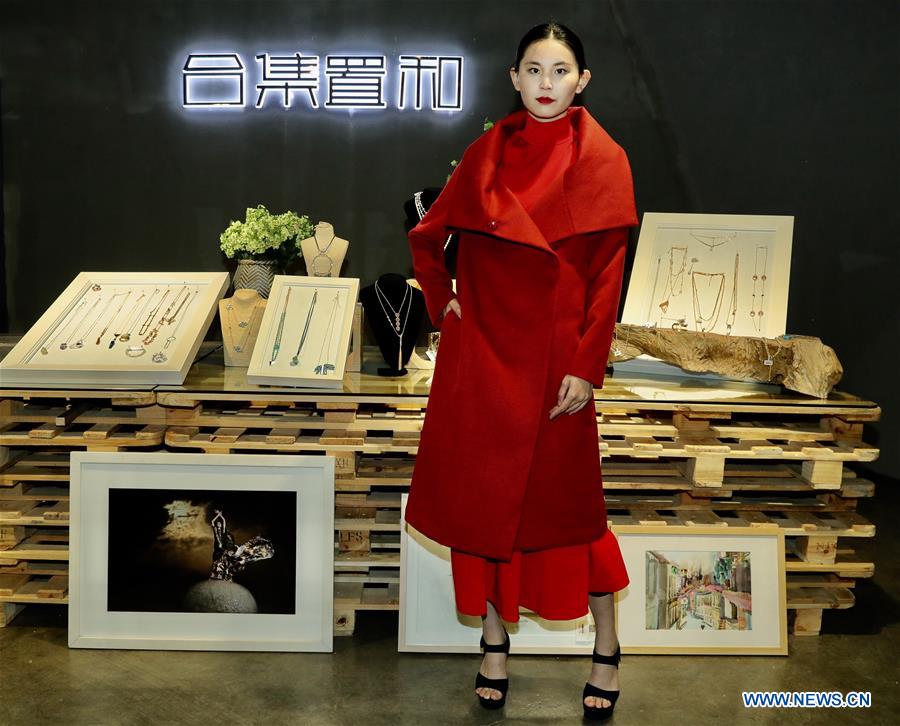 A model presents a creation of designer Zhang Yichao at an inauguration ceremony of an incubator of fashion and innovative talents in Hangzhou, capital of east China's Zhejiang Province, March 17, 2017. The talents incubator is jointly developed by fashion college of Zhejiang Sci-tech University, School of Fashion of Wuhan Textile University and a customization platform. (Xinhua/Chen Jianli) 