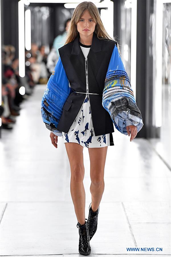 A model wears a creation by French designer Louis Vuitton as part of the  women's ready to wear spring/summer 2012 collection presented during the  Paris Pret-a-Porter fashion week, in Paris, France, 5