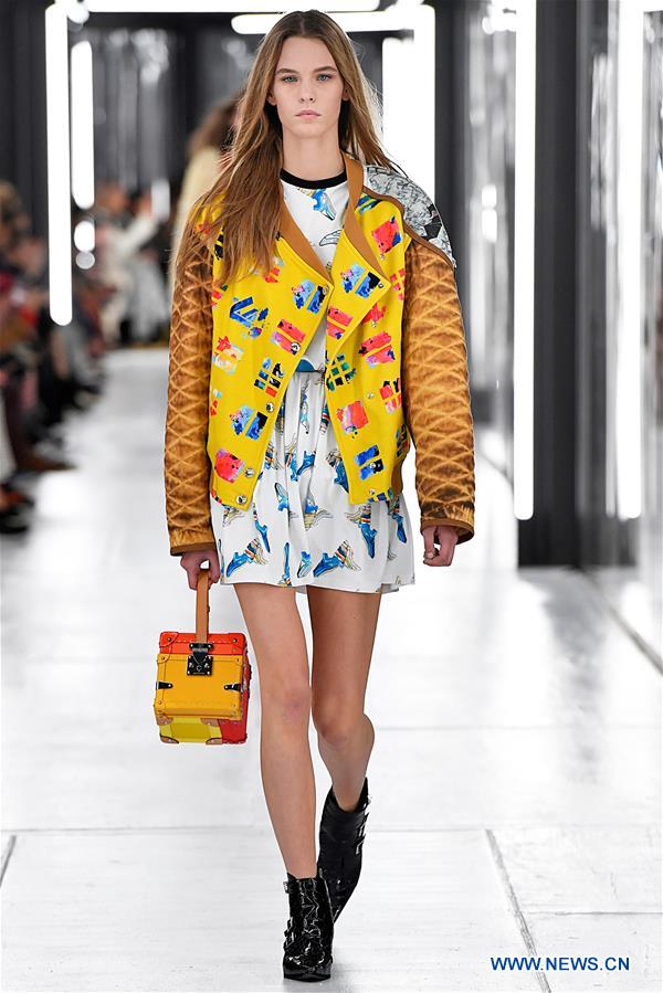 A model wears a creation by French designer Louis Vuitton as part of the  women's ready to wear spring/summer 2012 collection presented during the  Paris Pret-a-Porter fashion week, in Paris, France, 5