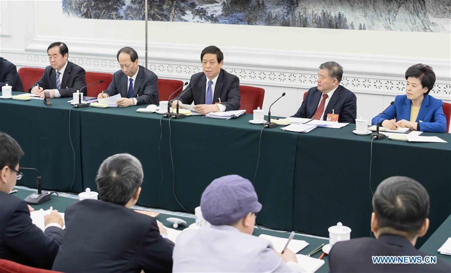 Chinese leaders attend panel deliberations at NPC's annual session