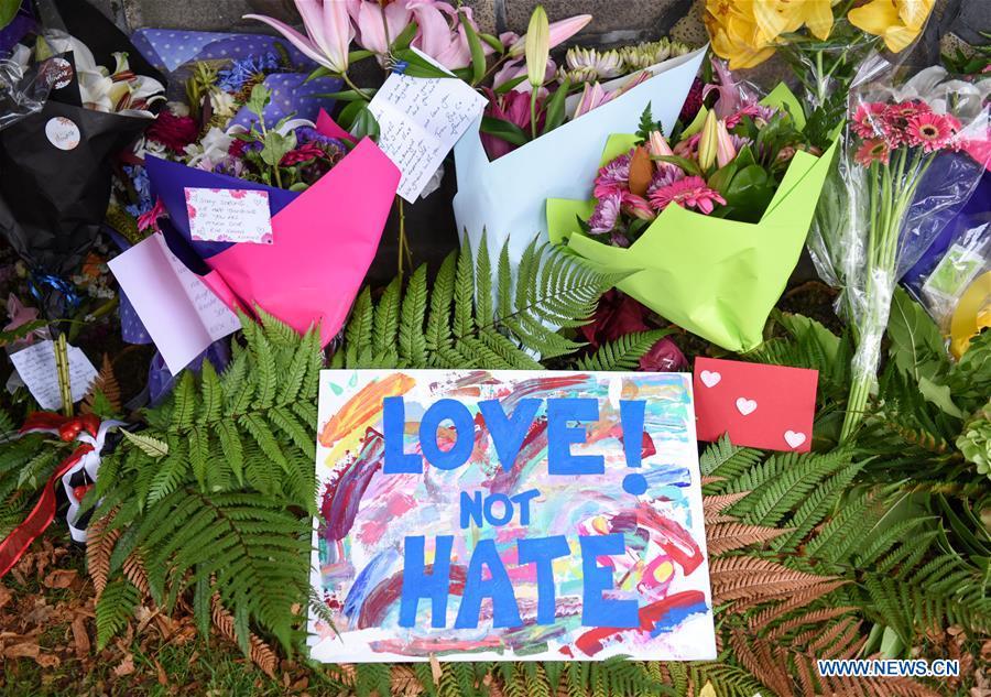 Photo taken on March 16, 2019 shows cards and flowers people placed to mourn the victims of the attacks on two mosques in Christchurch, New Zealand. It was revealed that a 28-year-old Australian man, Brenton Tarrant, conducted terrorist attacks targeting mosques in Christchurch and later was arrested by New Zealand Police. At least 49 people were killed and 48 are hospitalized now. (Xinhua/Guo Lei)