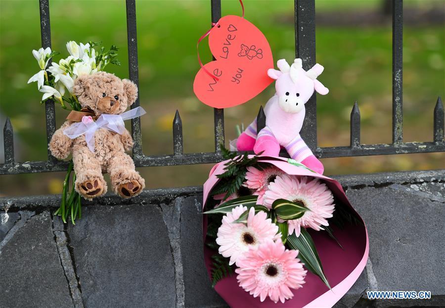 Photo taken on March 16, 2019 shows a card, toys and flowers people placed to mourn the victims of the attacks on two mosques in Christchurch, New Zealand. It was revealed that a 28-year-old Australian man, Brenton Tarrant, conducted terrorist attacks targeting mosques in Christchurch and later was arrested by New Zealand Police. At least 49 people were killed and 48 are hospitalized now. (Xinhua/Guo Lei)