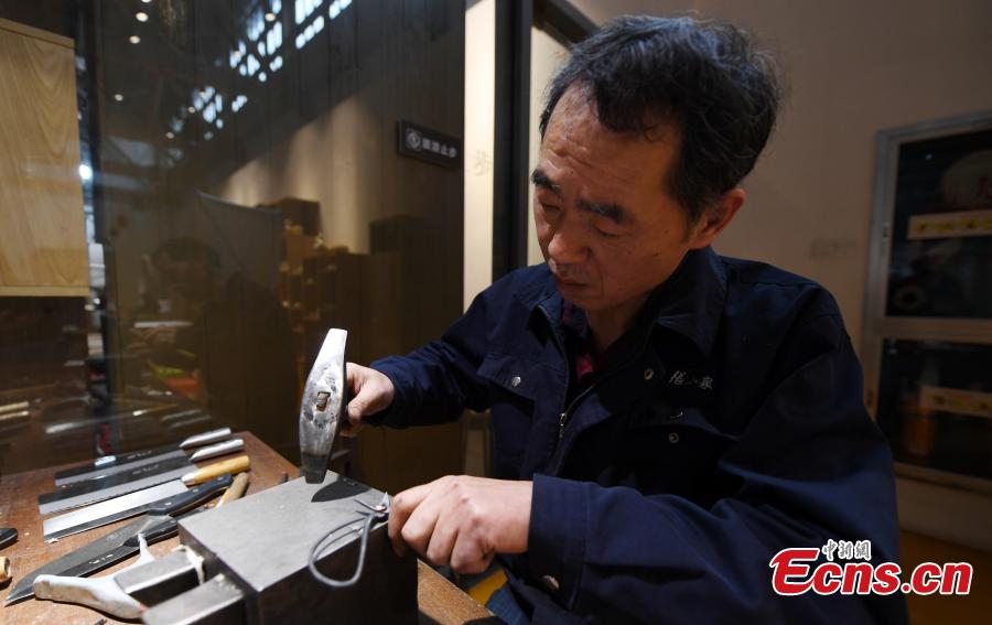 Craftsman Ding Jican makes Zhang Xiaoquan scissors using traditional methods in Hangzhou City, East China\'s Zhejiang Province, March 18, 2019. Zhang Xiaoquan scissors are a famous brand with a long history in China, and Ding has been committed to making the household utensil for 40 years. Ding himself is a master of the Zhang Xiaoquan scissor-making techniques, which have been perfected over the centuries and are recognized in China as a state intangible cultural heritage. (Photo: China News Service/Wang Gang)