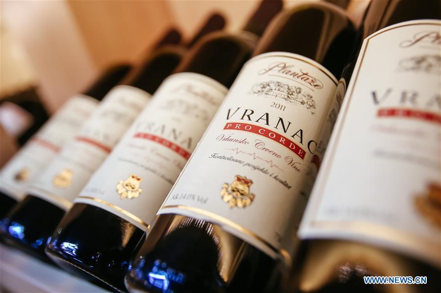 Bottles of wine imported from Montenegro are seen at the Yiwu International Trade City in Yiwu, east China\'s Zhejiang Province, May 4, 2017. Food of a particular place is an important symbol of local geographic and cultural characteristics. Food carries history and tradition, leads the tide of trade, strengthens diplomatic relations, disseminates and promotes culture. Food has been serving as connections between people around the world. In ancient times, food such as grapes, pomegranates, walnuts, coriander, cucumbers and sesame seeds were introduced to China along the Silk Road. Nowadays, thanks to the Belt and Road Initiative, red wine, coffee, dried fruits, meat, seafood, and dairy products from foreign countries enter the homes of ordinary people, turning daily meals into feasts with exotic cuisines. (Xinhua/Zhang Cheng)