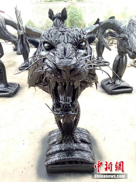 Cao Shengge shows his homemade sculptures made out of used tyres in Xingtai City, Hebei province. Cao became interested in making sculptures with tyres in 2015. He has recycled nearly 50 tons of otherwise waste tyres to create about 100 works, including mythical figures, beasts, and the twelve zodiac animals. He said the tyres usually needed to be cut into pieces and then put together to form a creation, a process that may take tens of days. Cao also said he hopes to organize an exhibition of his works and promote public awareness of environmental protection. (Photo provided to China News Service)