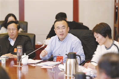 新区政协委员分组讨论政协常委会工作报告和提案工作报告 韩远达参加